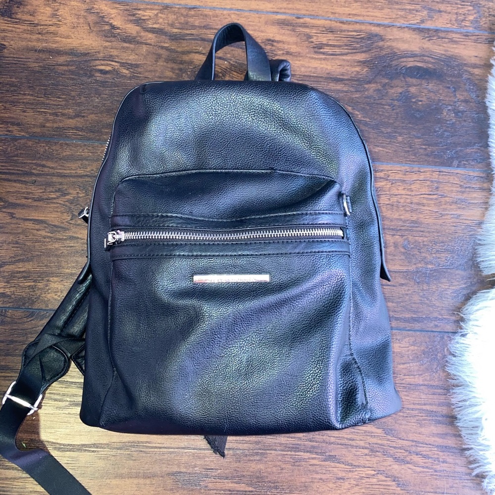 Steve Madden black leather backpack.